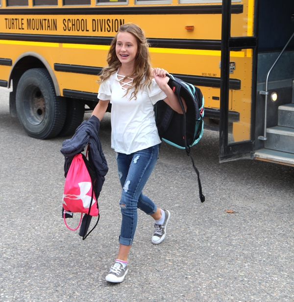 Makenna Beard excitedly gets off the bus at Boissevain School, looking forward to the many new experiences this school year will bring. Classes resumed in Turtle Mountain School Division on September 6.