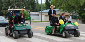 The grad parade has become a tradition for Boissevain School. Parker Maxwell (L) and Carter Thio hold one side of North Railway Street while Ryan Denbow, George Vorster and Nathan Stokes come down their left.