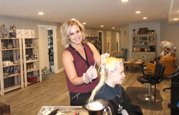 Kamara Sisson puts some colour in the locks of Journey Rommelaere. Sisson and REKK Beauty were recently recognized for reaching impressive sales targets. In December, they reached Gold sales level for Surface, a hair product from a company founded in Saskatoon, purchased from ESP. She will be picking up her award in Las Vegas in a week recognizing REKK as one of their top salons. A few weeks ago in Nashville, REKK was recognized as one of the top 52 salons in North America. New ESP numbers coming in show they are one of their top salons in Canada, and they are a top salon in Southwest Manitoba. Sisson is happy and humbled by her continued success.