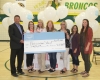 Ryan Polnik (left) of Boundary Co-op presents a donation from the Co-op Community Spaces program to the school committee for an outdoor classroom – Kim McKay, Sonia Harper, Cassandra Sprott, Shelly Mills, Krista Clyne and PJ Ricard. 			