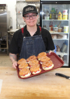 Alex Moody with a tray full of baked treats. Moody and the Boissevain Bakeshop won Small Business of the Year from Tourism Manitoba.