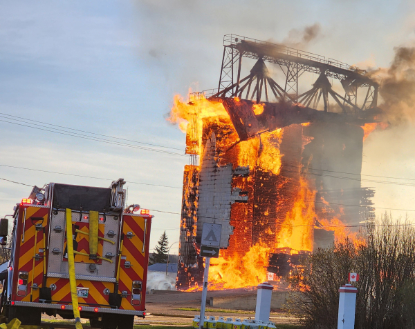 A blaze, thought to be caused by a lighting strike, burned down the old Pool elevator in Waskada on May 5. Although discovered early in the morning, firefighters from three departments were unable to save the structure, which was being used for grain storage.