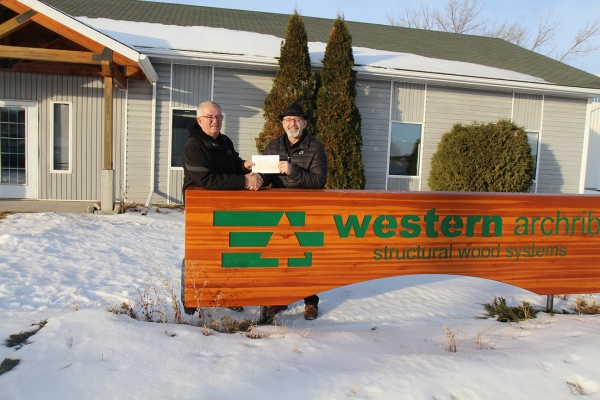 George Heide (l) of Southwest Seniors Housing accepts a donation of $40,000 from Boissevain Western Archrib Branch GM Sid Braybrook. The donation will help the group planning an assisted living complex meet their $2 million fundraising goal.