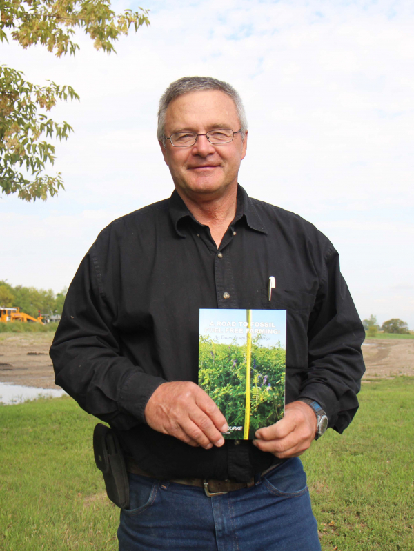 Author David Rourke with his new book on farming and climate change.