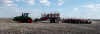 On May 12, the wind was just starting to take its practice runs while Brett and Bill Hodgson of Hodgson Farms worked on sowing beans west of Elgin. In two days time, the area would be hit with horrendous blowing and dust storms. Seeding has progressed fairly well, with warmth and moisture needed.	 