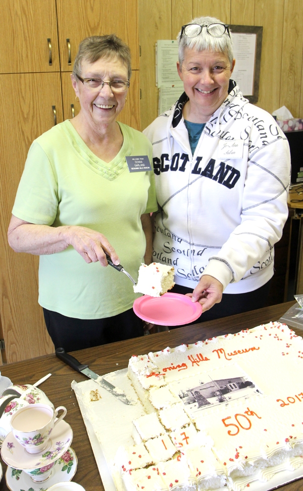 Museum President Donna Garland and Volunteer Jo-Ann Saban cut and serve cake at the celebration.