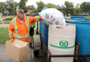 Bob Barwick (left) and Gib Beard of T &amp; S Recycling load up recyclables in the rain on Thursday morning. The business will soon be making its last tour through the community as Tina and Scott Patterson are closing up by the end of the month, after more than 30 years. Their last day will be September 24. Whether or not someone else will start a new curbside pick up remains to be seen. 