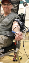 Ed Facey donates blood at the mobile donor clinic in Boissevain on March 14.