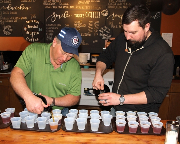 Kevin Houston and Dan Paschke pour samples at the Sawmill’s Craft Beer Night. 